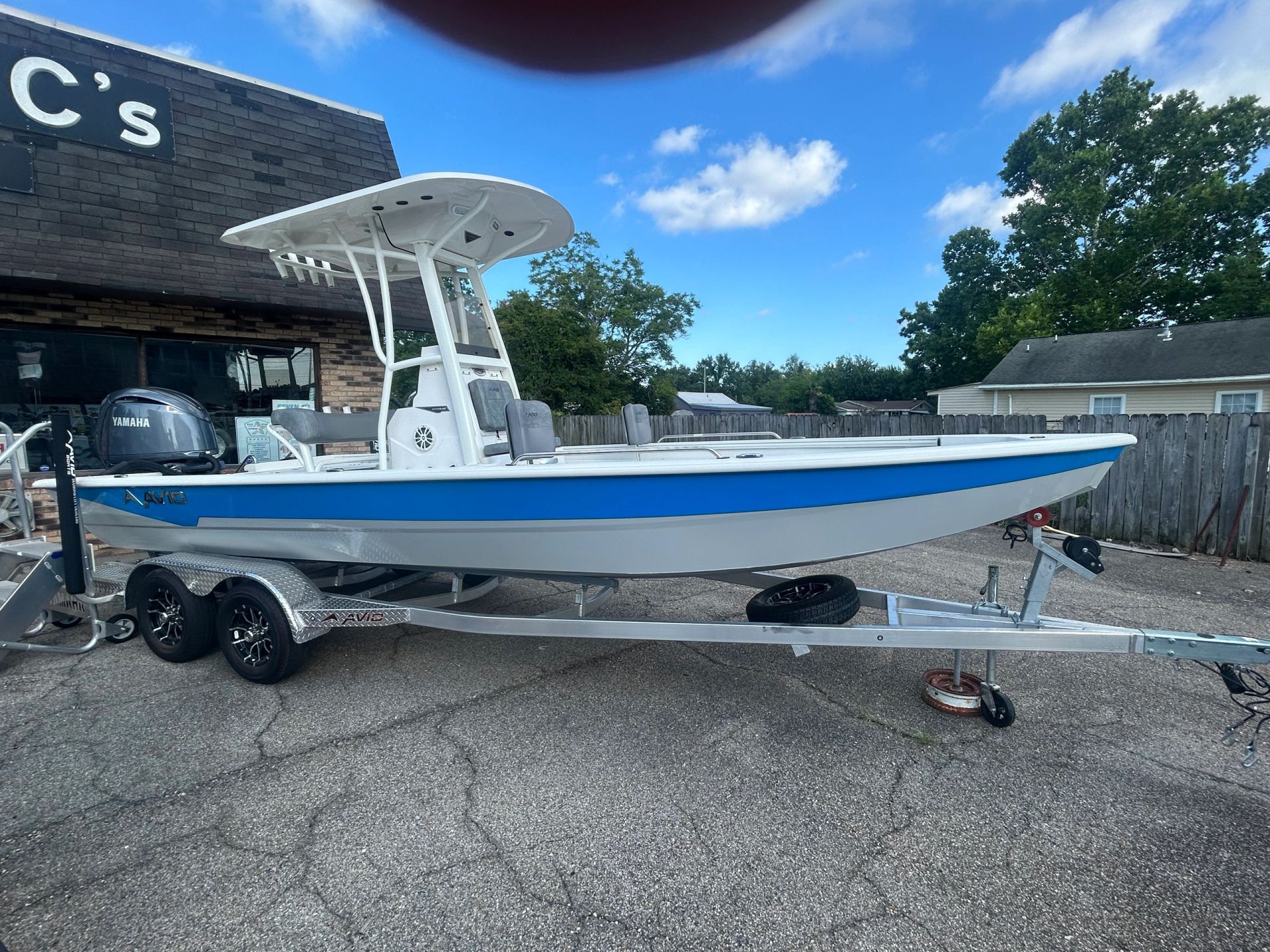 Avid boat with tower at the shop